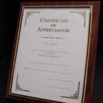 Framed certificate of appreciation with elegant design.
